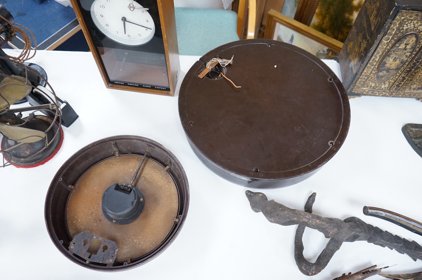 Two 20th century electric wall clocks, including a Smith’s Bakelite example, largest 47cm diameter